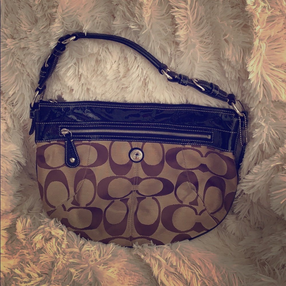 Classic “C” canvas and patent leather hobo.